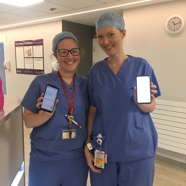 Doctors at Kingston Hospital with their Pando apps.JPG